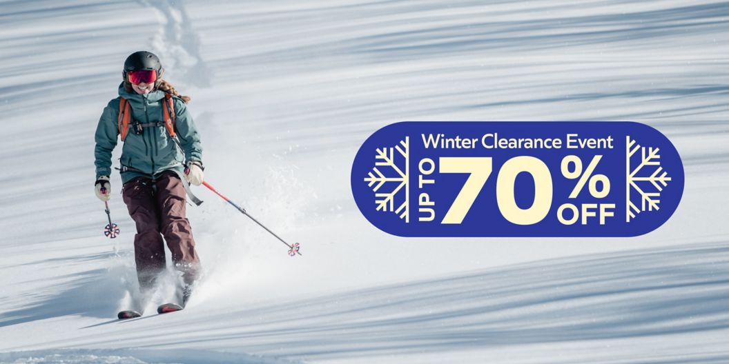    A smiling person skis. Text overlay reads: Winter clearance event, up to 70% off. 