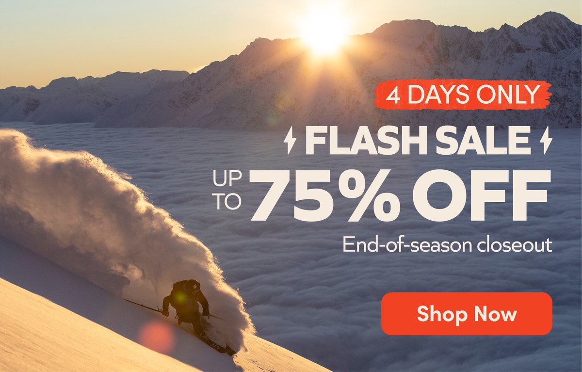 A skier slashes pow, the sun sets over the mountains. 3 days only: up to 75% off Flash Sale. 