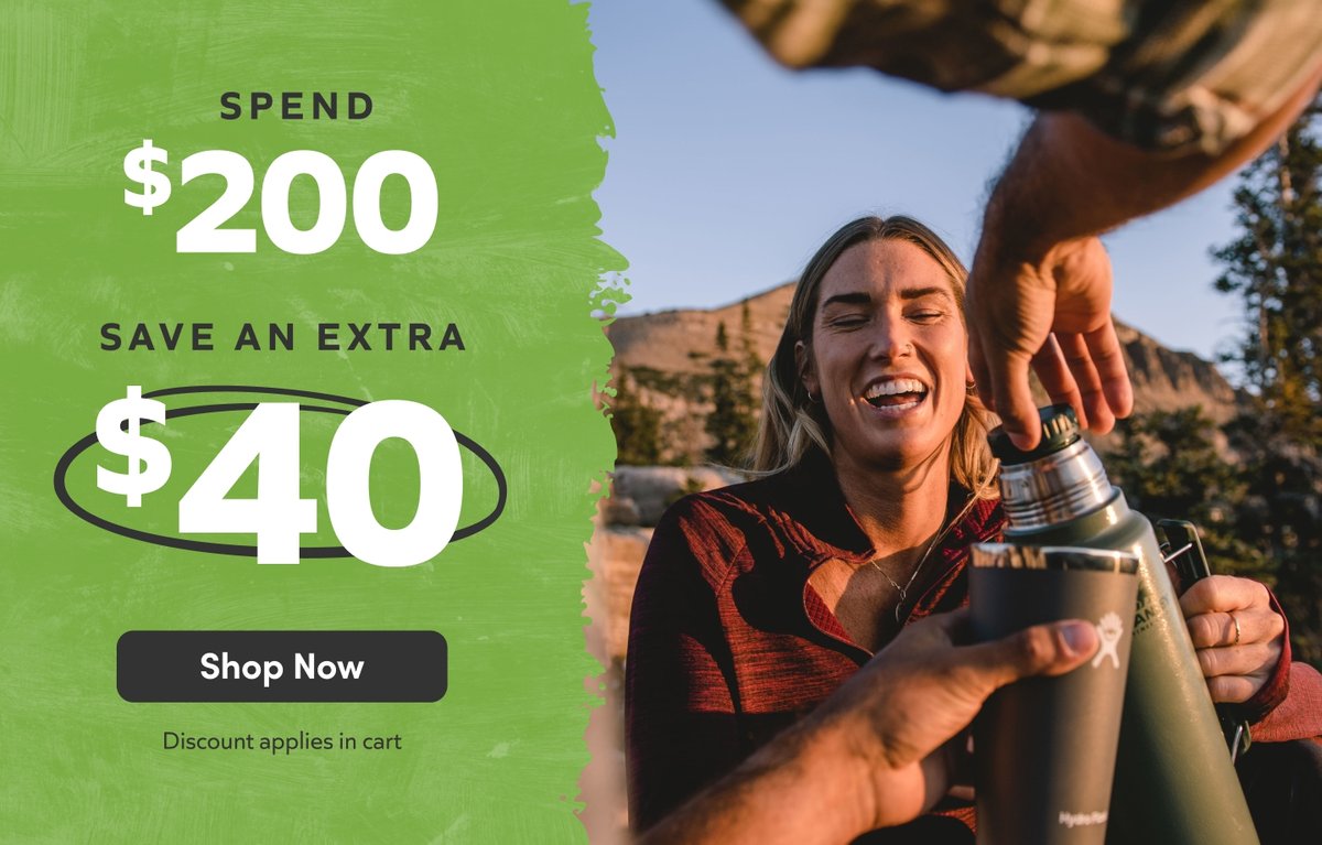 Spend $200, save an extra $40 — discount applies in cart. Smiling woman outdoors pouring from an insulated bottle in the mountains. Shop Now.